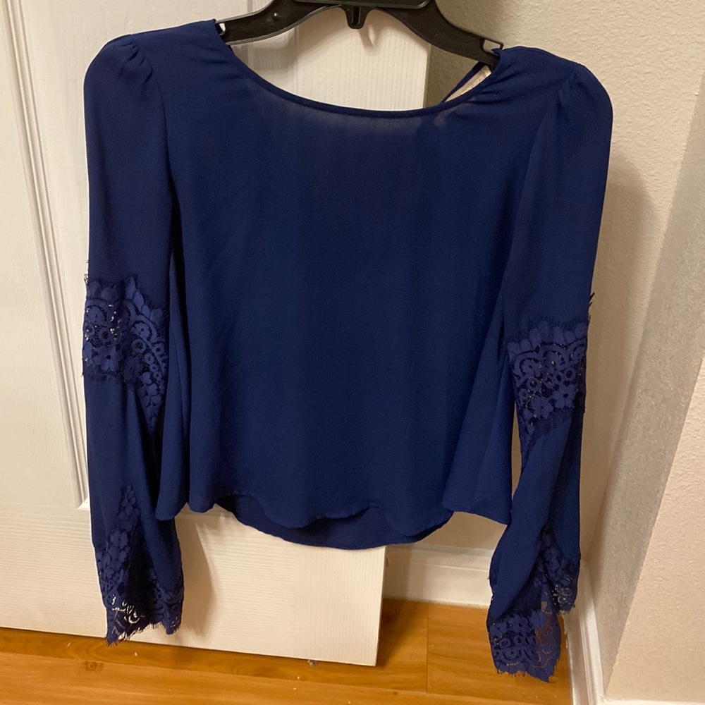 Beautiful blue top with detail in the sleeves